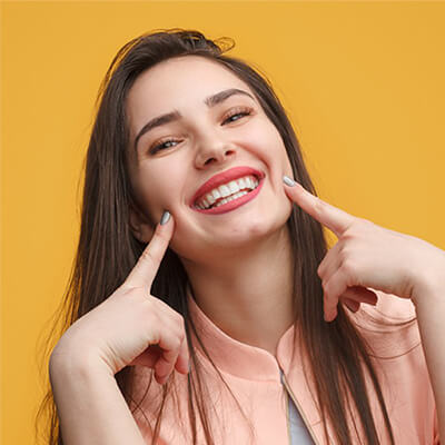 Image with a brunette girl smiling back at the camera