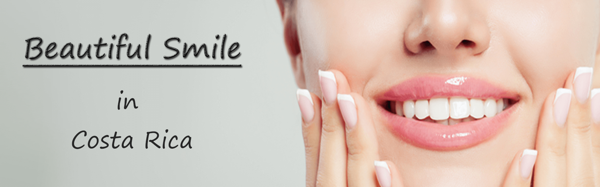 A close-up picture of a smiling woman displaying beautiful dental work done by the top dentists in Costa Rica.  The woman is holding her hands up to the sides of her face to highlight her perfect teeth.